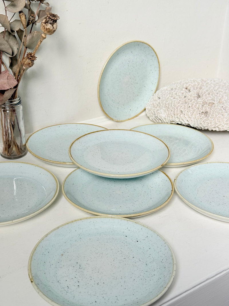 Set of 8 Churchill speckled duck egg side plates with warm rim photographed on a white surface