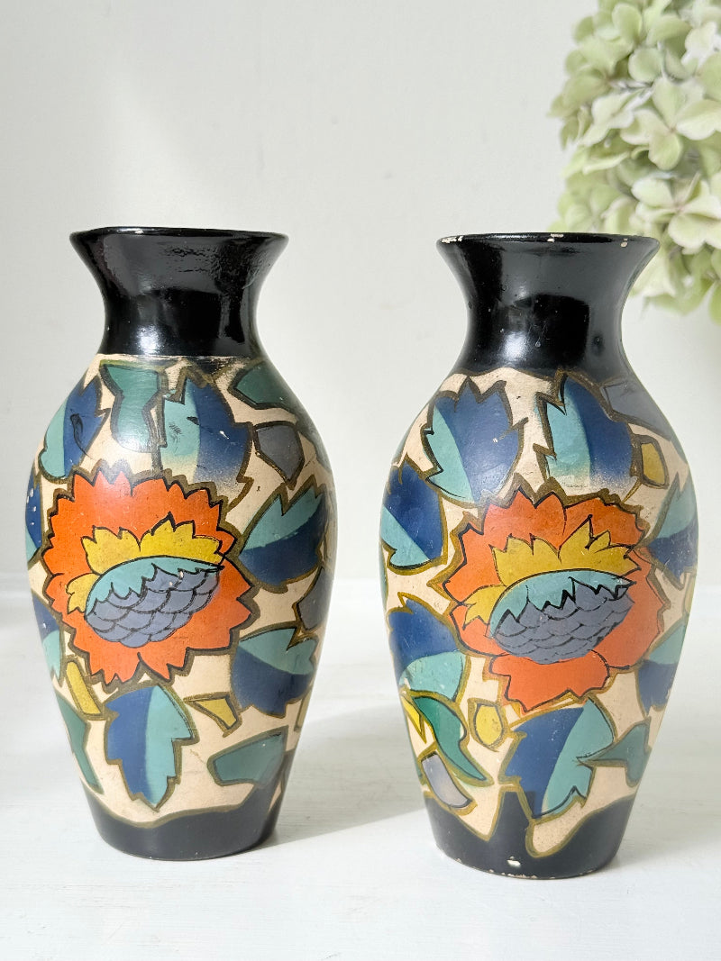 Pair of hand painted Brentleigh Ware Art Deco stoneware vases with bold floral design, photographed on a white surface