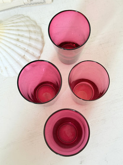 Set of 4 vintage cranberry glass tumblers in tall beaker form with deep pink colour and one slightly paler glass