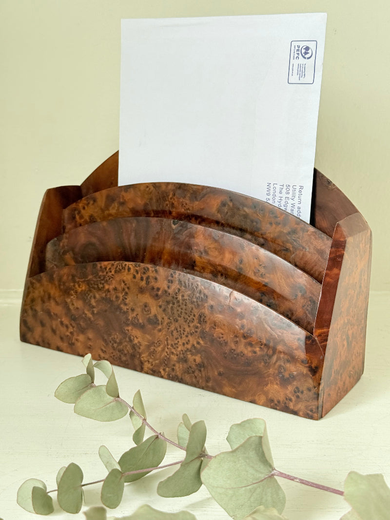 Three-slot curved letter rack made from polished burl wood with rich swirling grain, mid-century style desk organiser.
