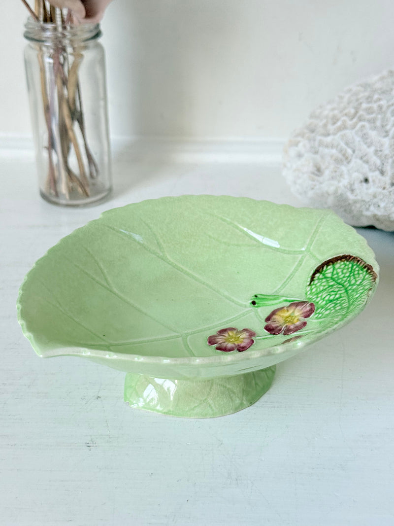 Vintage Carlton Ware green leaf pedestal dish with pansy decoration, photographed on a white surface