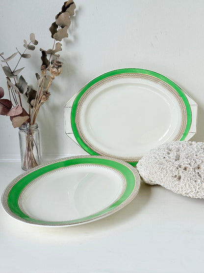 Pair of vintage oval serving platters with bright green Art Deco style border photographed on a white surface