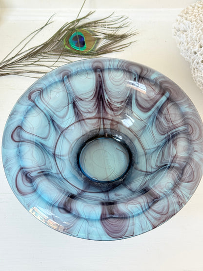 George Davidson blue cloud glass bowl with purple marbled swirls, photographed on a white surface