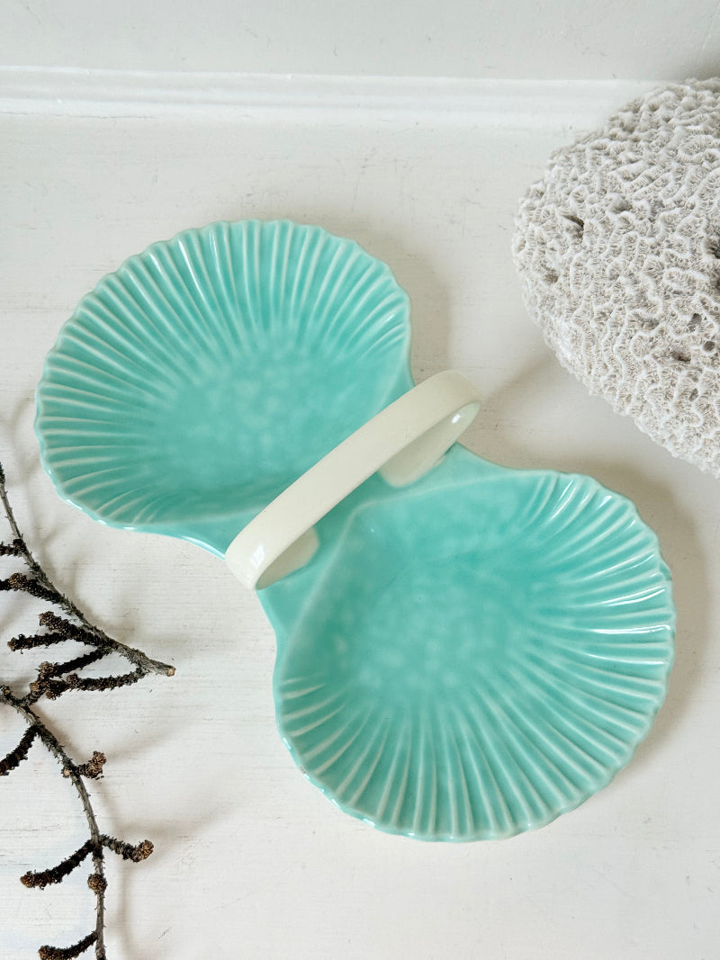 Poole Pottery Shagreen double scallop dish in sea green glaze photographed on a white surface
