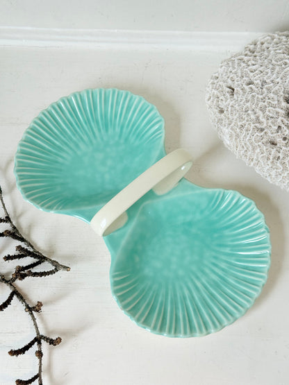 Poole Pottery Shagreen double scallop dish in sea green glaze photographed on a white surface