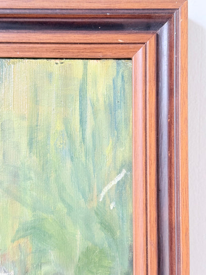 Oil painting of a dog by Muriel Hester Broughton in wooden frame, photographed on white surface.