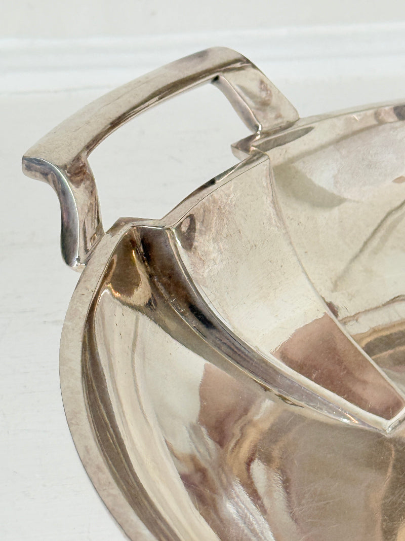 Art Deco silver plate serving dish with stepped handles on a white surface, Goldsmiths and Silversmiths Company Regent Plate