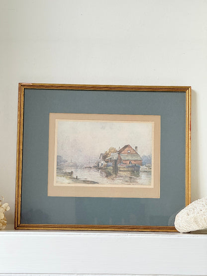 Vintage framed print of riverside mill by F Robson, gilt frame with blue mount, rustic water scene, photographed on white surface.