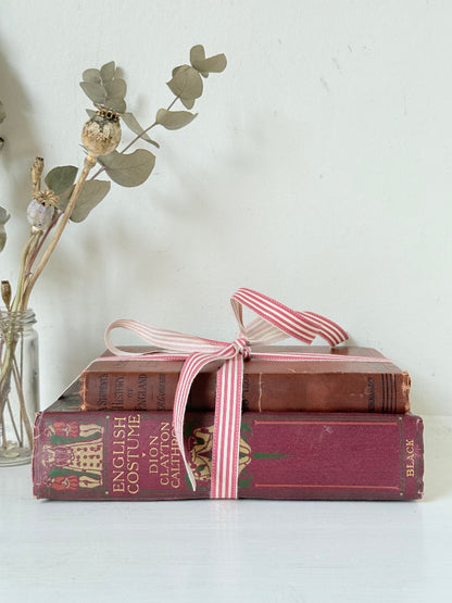 Vintage book bundle of English Costume and History of England with burgundy and brown hardback covers, photographed on a white surface