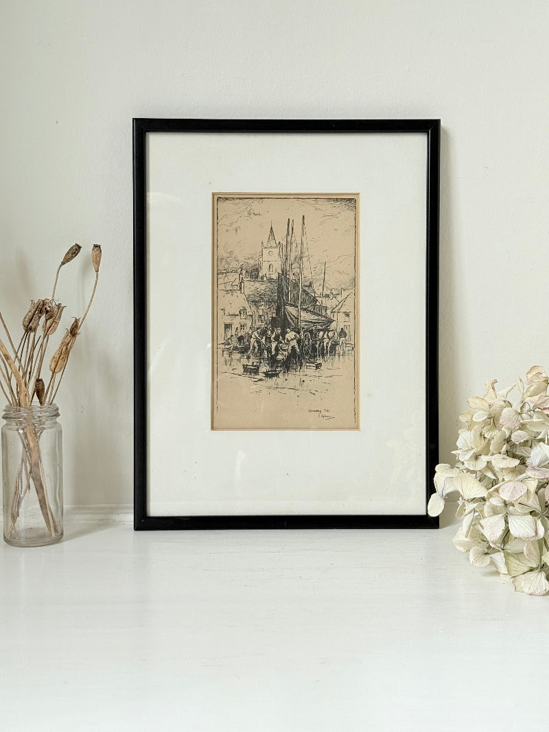 Vintage fishing harbour print in black frame, nautical scene wall art, styled on white surface with coastal decor accents