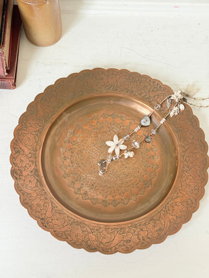 Vintage hand engraved copper tray with scalloped edge, bird and floral motif and warm aged patina for boho interiors