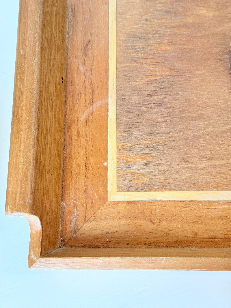 Vintage wooden tray with cat marquetry inlay, photographed on a white surface