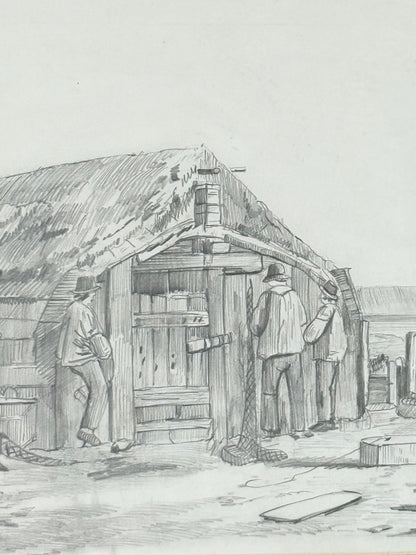 Vintage pencil drawing of rural scene with outbuildings and figures, under glass in black wooden frame, photographed on white surface.