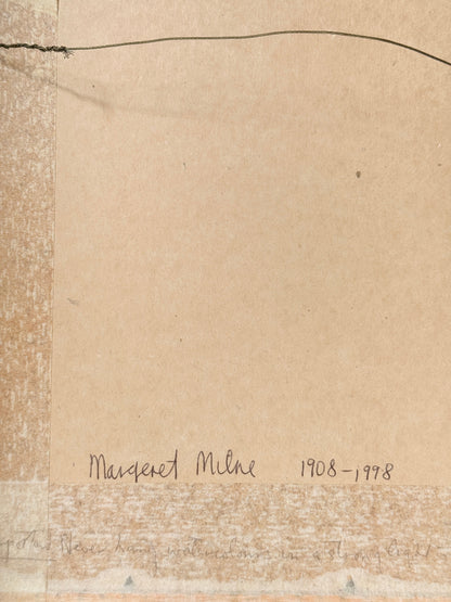 A close-up of a beige paper or cardboard surface with a handwritten inscription reading &