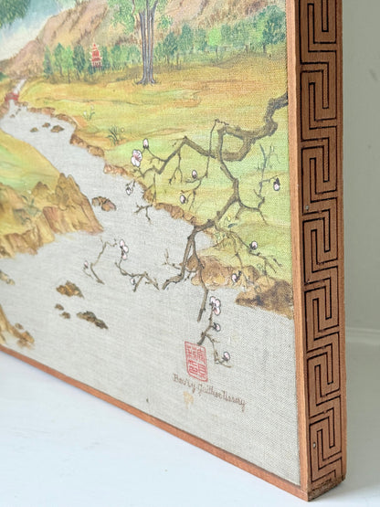 Vintage Chinese watercolour landscape on canvas with tree, mountains and blossom, photographed on white surface