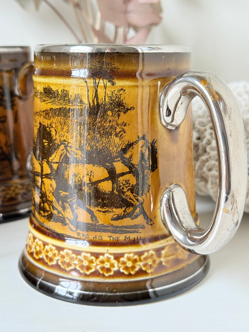 Set of 4 large Ridgways stoneware beer tankards photographed on a white surface in amber treacle glaze with black Coaching Days and Coaching Ways transfer scenes