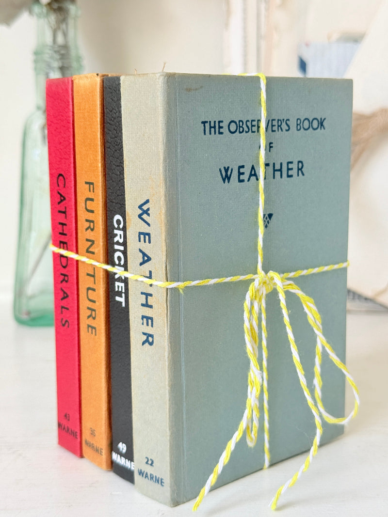 A set of four vintage hardcover books tied together with yellow-and-white twine. The front book is titled "The Observer&