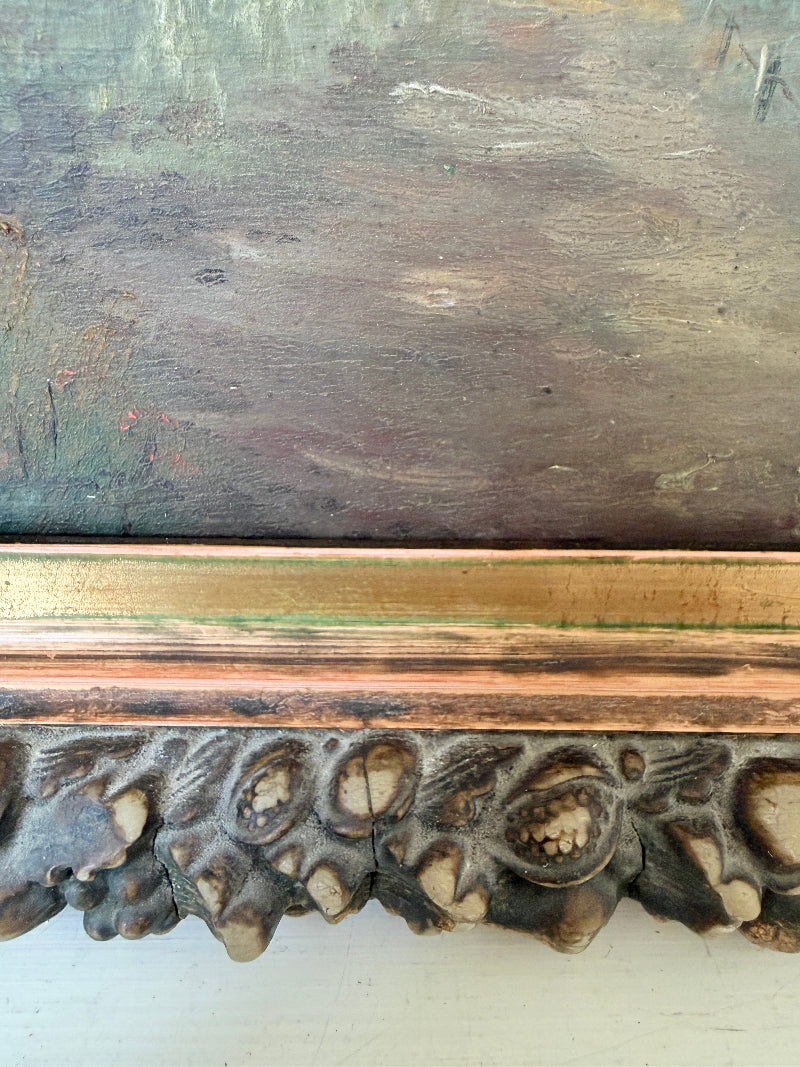 Close-up of an antique framed painting, showing a distressed gold and brown carved frame against a textured, weathered painted surface.