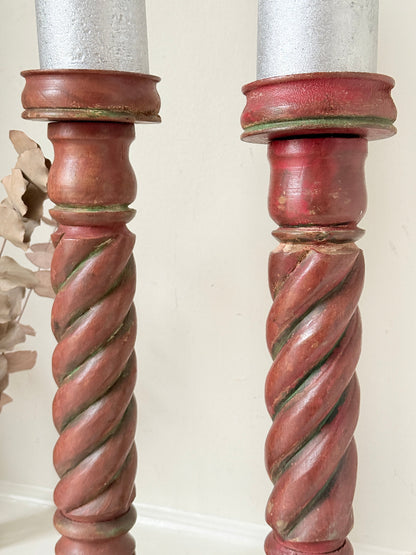 Vintage wooden barley twist candlesticks, a pair with painted finish, photographed on a white surface