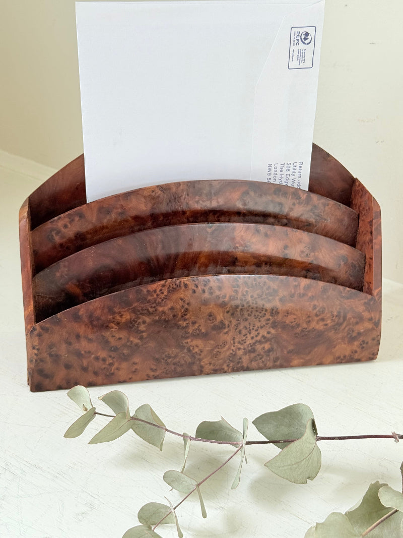 Three-slot curved letter rack made from polished burl wood with rich swirling grain, mid-century style desk organiser.