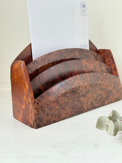 Three-slot curved letter rack made from polished burl wood with rich swirling grain, mid-century style desk organiser.
