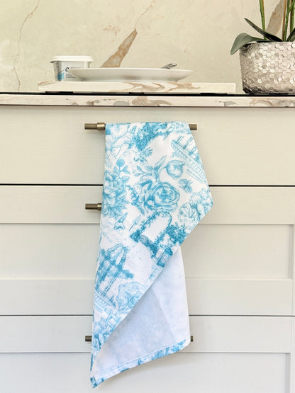 The Blue Loft toile cotton tea towel in turquoise on white with rural scenic print