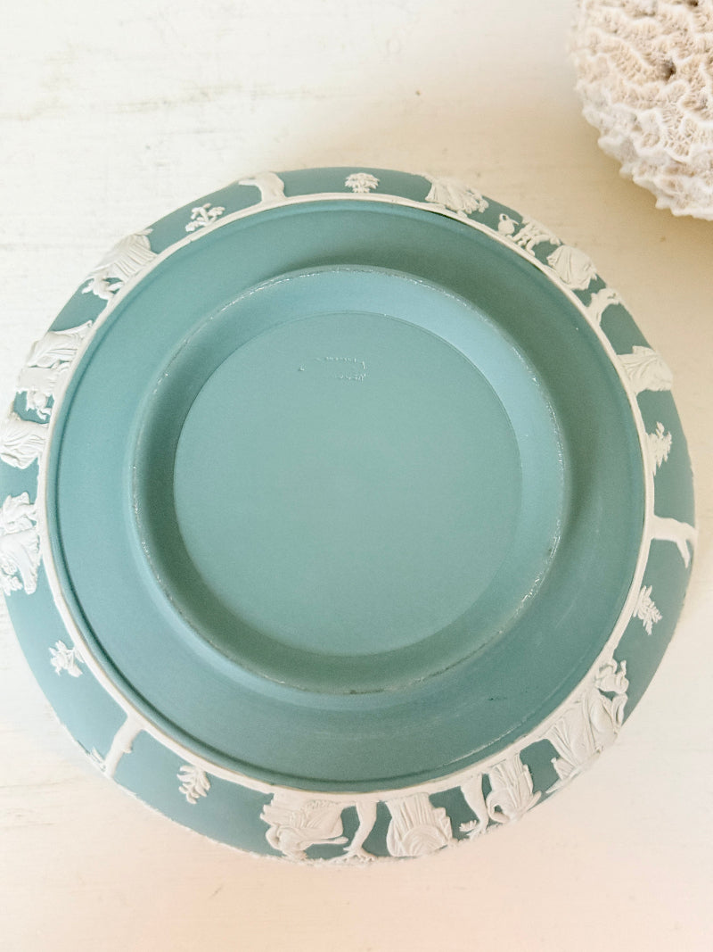 Large vintage Wedgwood Jasperware teal green fruit bowl decorated with white classical figures beneath stylised trees and a laurel garland border.