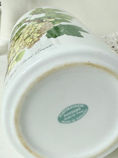Vintage Portmeirion Botanic Garden ceramic canister with wooden lid and hydrangea design photographed on a white surface.