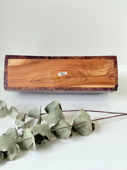 Three-slot curved letter rack made from polished burl wood with rich swirling grain, mid-century style desk organiser.