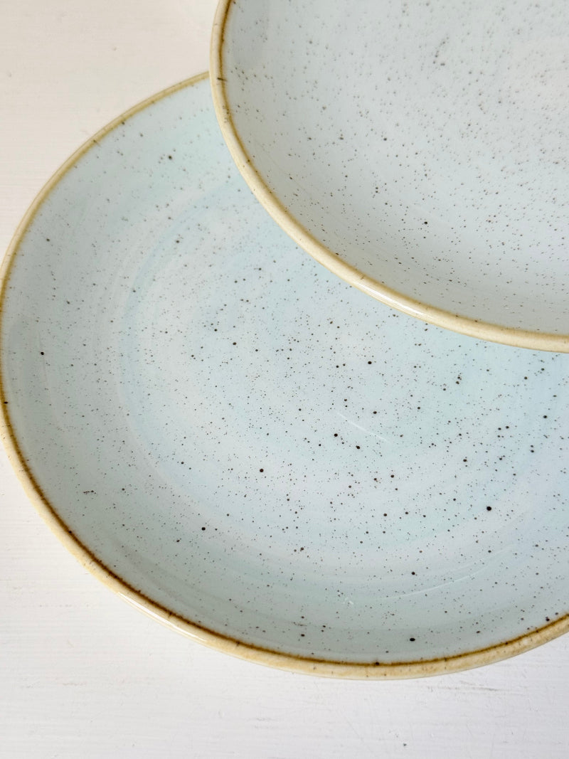 Set of 8 Churchill speckled duck egg side plates with warm rim photographed on a white surface