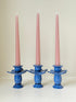 Trio of &Klevering Amsterdam cobalt blue ceramic candle holders with hand painted detail and pink taper candles