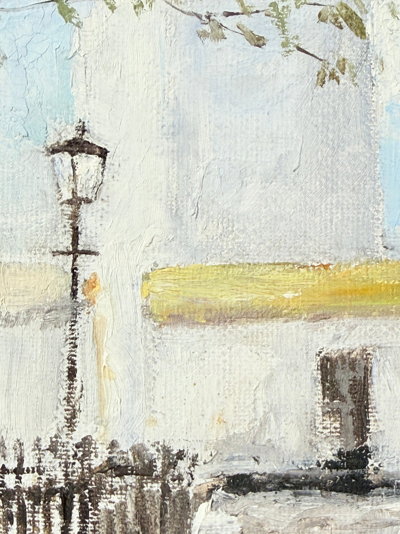 Impressionistic painting of a street scene featuring a white stucco building, a black street lamp, a yellow wall accent, and a light blue sky.