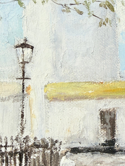 Impressionistic painting of a street scene featuring a white stucco building, a black street lamp, a yellow wall accent, and a light blue sky.