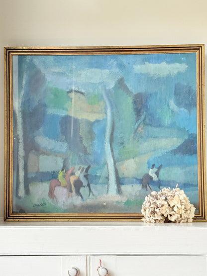 A framed impressionist landscape painting featuring blue, green, and gray tones with horse riders, displayed on a white mantelpiece next to a dried floral arrangement.