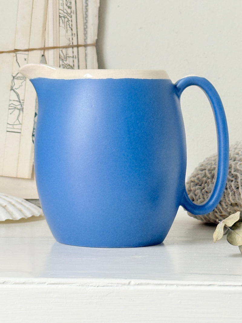 Vintage cornflower blue glazed stoneware jug with cream interior, pulled spout and curved handle for kitchen styling