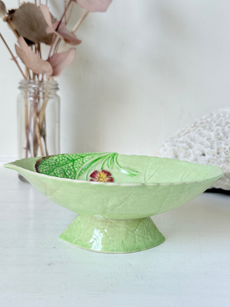 Vintage Carlton Ware green leaf pedestal dish with pansy decoration, photographed on a white surface
