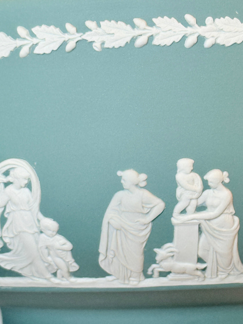Large vintage Wedgwood Jasperware teal green fruit bowl decorated with white classical figures beneath stylised trees and a laurel garland border.