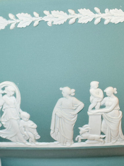 Large vintage Wedgwood Jasperware teal green fruit bowl decorated with white classical figures beneath stylised trees and a laurel garland border.