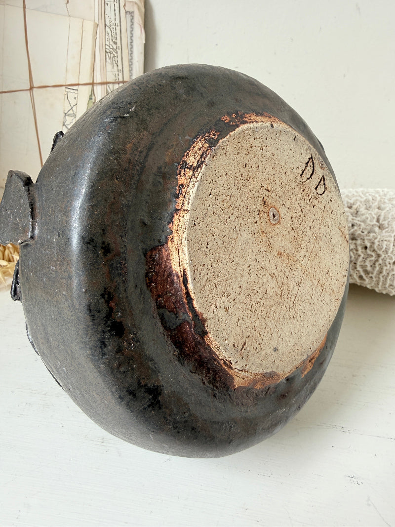 Studio pottery ceramic vase with liquorice grey glaze, applied floral and leaf detail and rounded handmade form