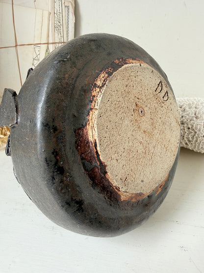 Studio pottery ceramic vase with liquorice grey glaze, applied floral and leaf detail and rounded handmade form