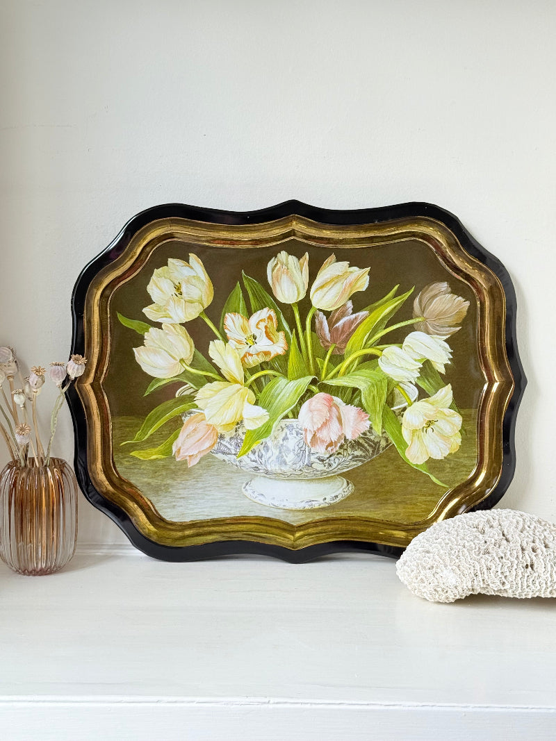 Large vintage printed tulip tray with scalloped edge and black lacquered finish, photographed on white surface.