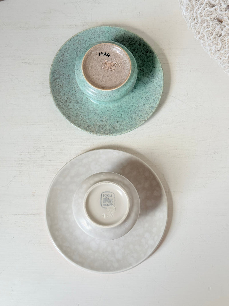 Pair of Poole Pottery mushroom posy vases in seafoam green and blush pink glazes photographed on a white surface