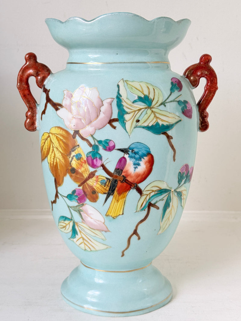 Pair of Paris porcelain Aesthetic Movement vases from the late 1800s, hand painted with birds, blossom and coral handles