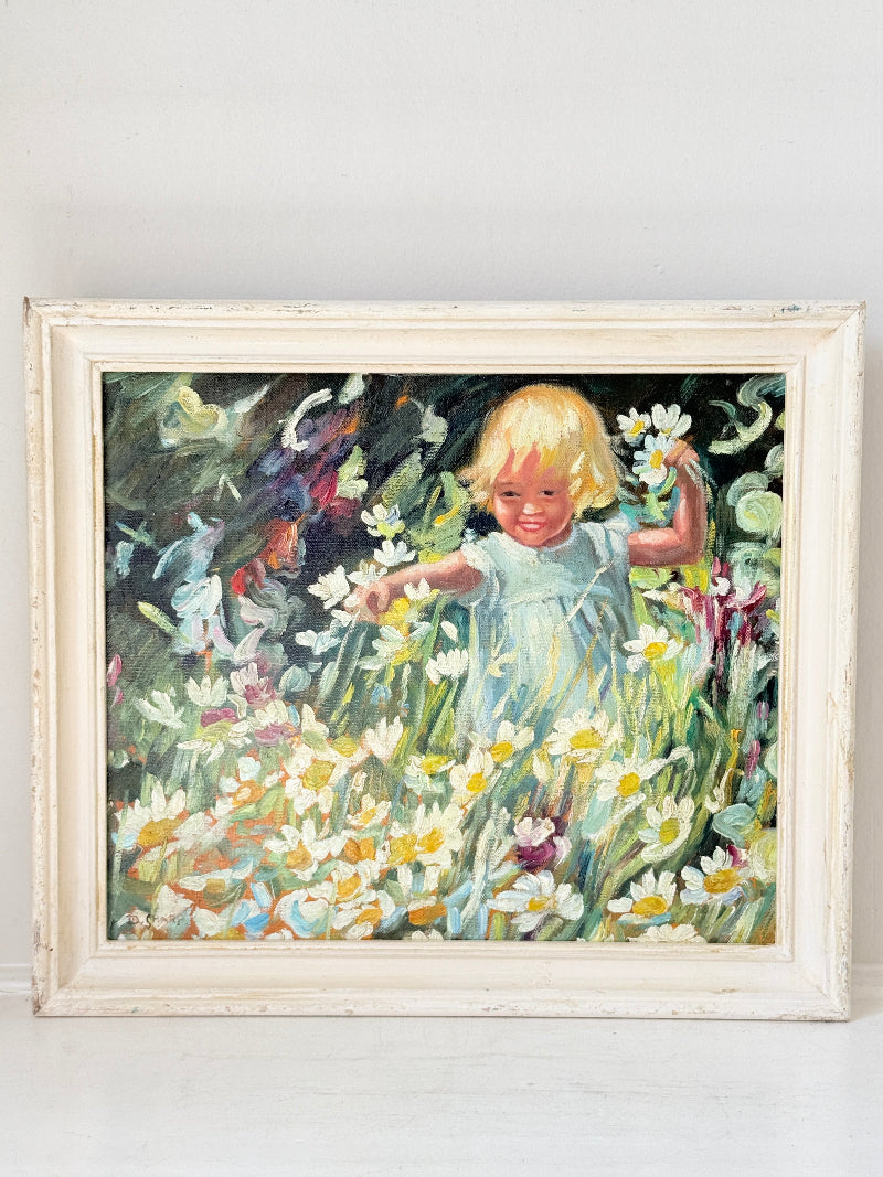 Oil painting after Dorothea Sharp of a young girl picking white flowers in a meadow, distressed white wood frame