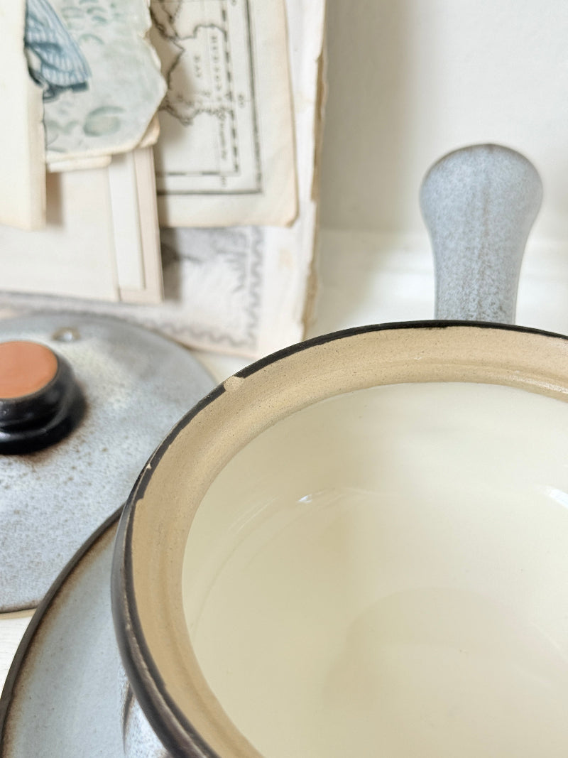 Denby Studio pair of lidded soup bowls with stands in grey and rust photographed on a white surface