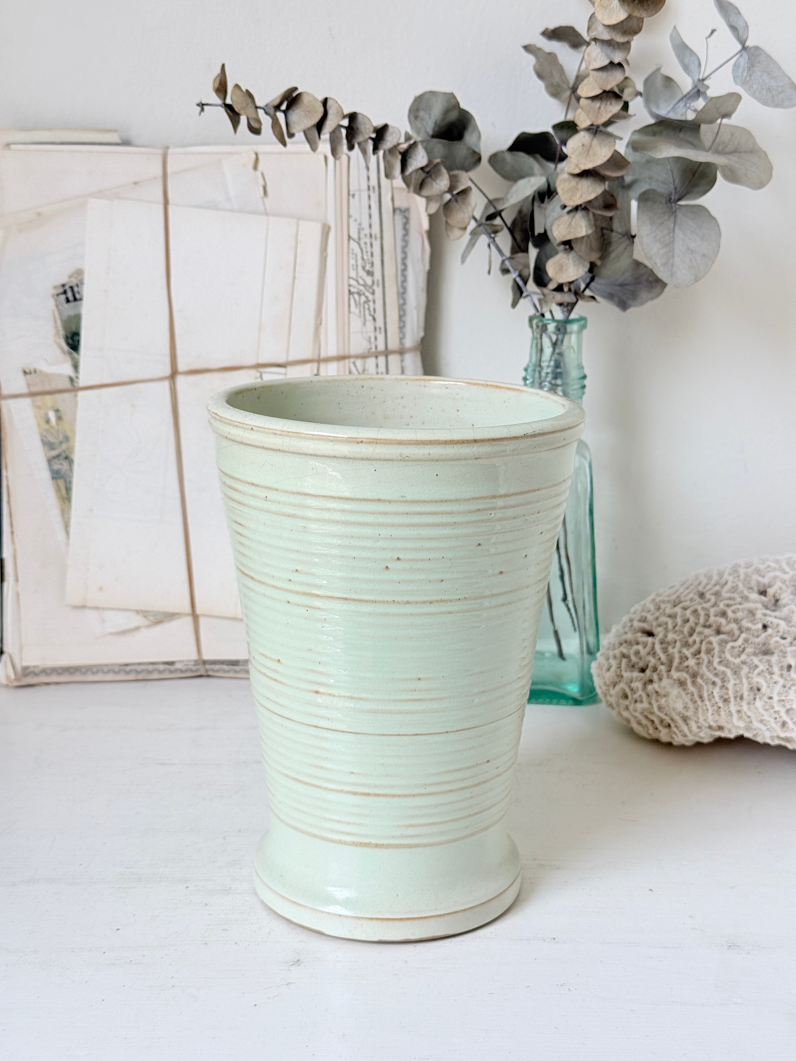 1960s Burton Ware ribbed stoneware pot in sage green, photographed on a white surface
