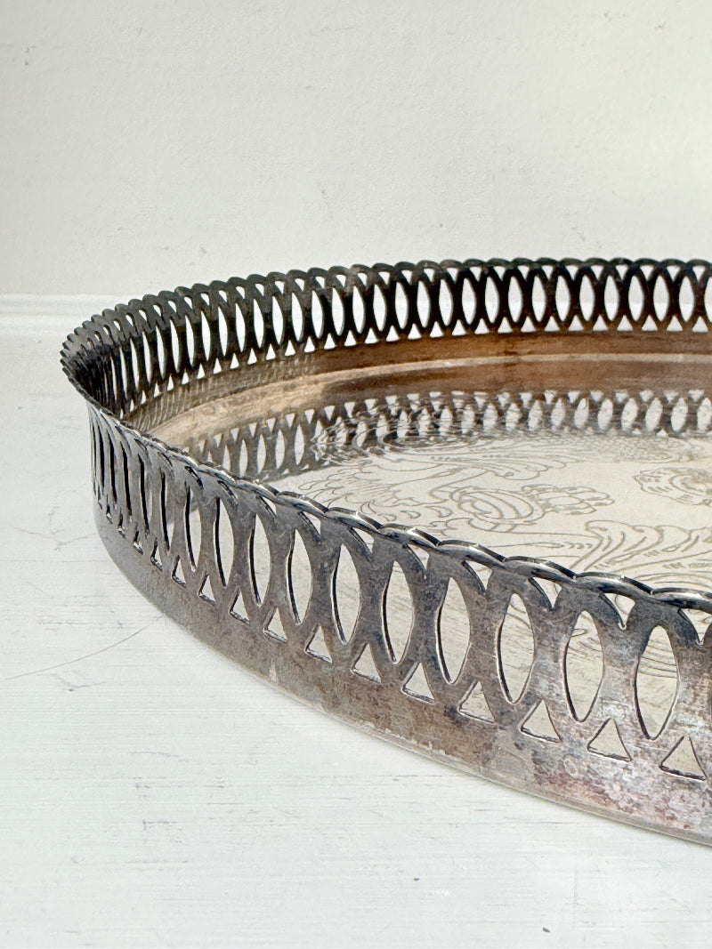 Vintage round silver plated gallery tray with pierced rim, engraved centre and aged patina for drinks or vanity styling