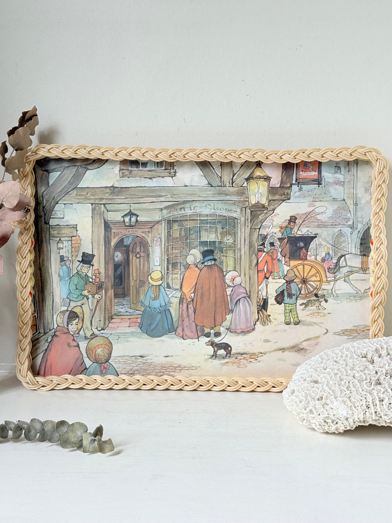 Vintage melamine tray with wicker effect edge and Victorian street scene, photographed on a white surface