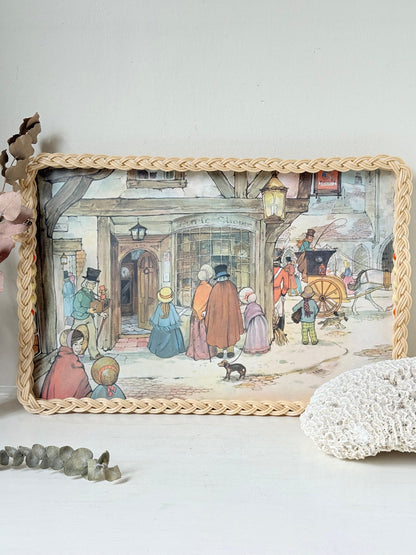 Vintage melamine tray with wicker effect edge and Victorian street scene, photographed on a white surface