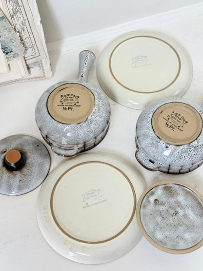 Denby Studio pair of lidded soup bowls with stands in grey and rust photographed on a white surface
